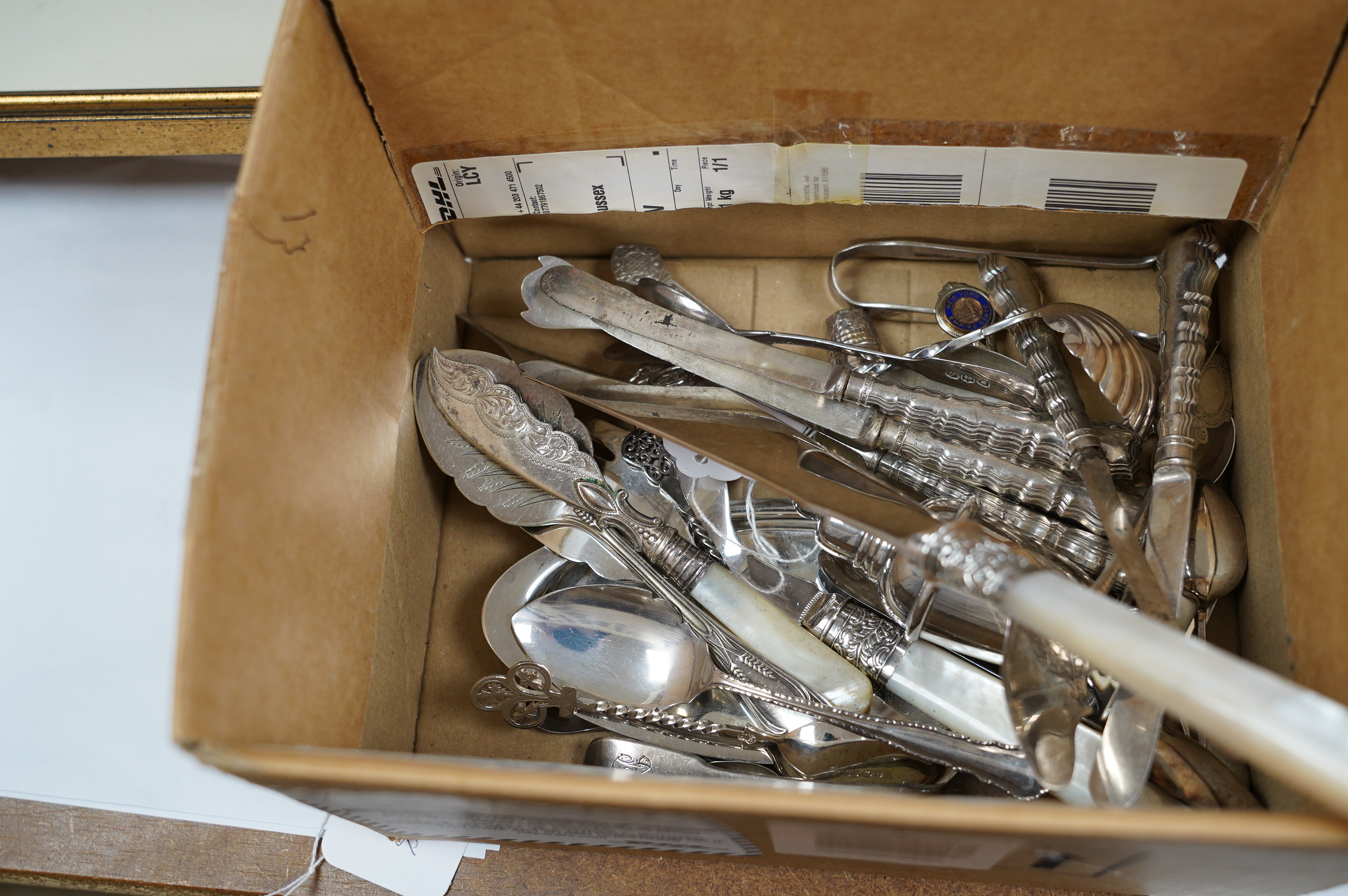 A small group of assorted teaspoons, condiment spoons, small servers, etc. including a Millennium seal top spoon by A. E. Jones Ltd and a Victorian shell bowl ladle by Jehoiada Alsop Rhodes and a silver thimble together